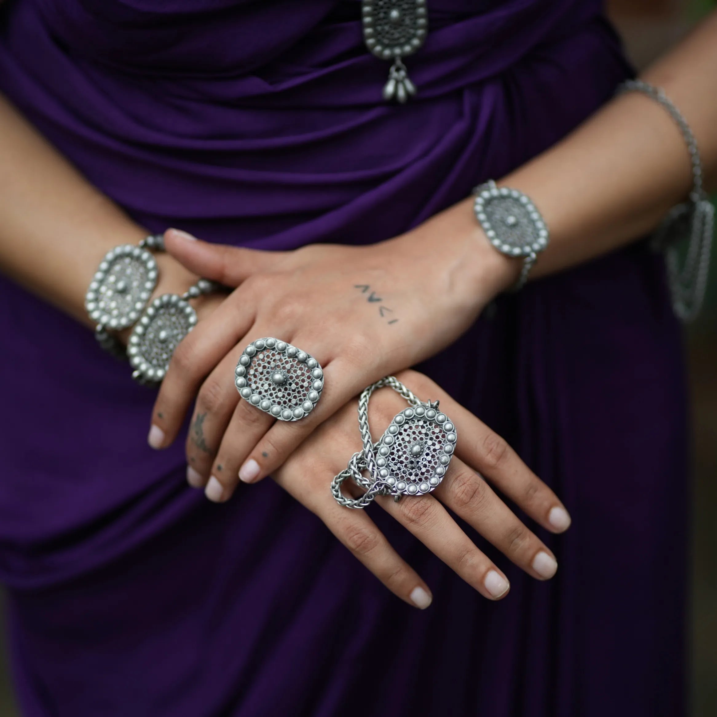 Model wearing Jalakriti oxidised brass tribal ring styled with matching Complimento jewelry by Complimento
